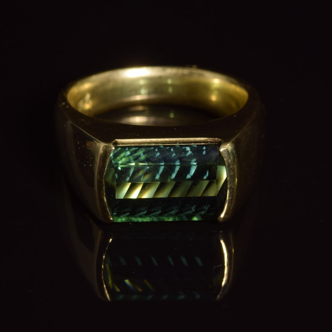 18K green tourmaline fantasy cut baguette ring.