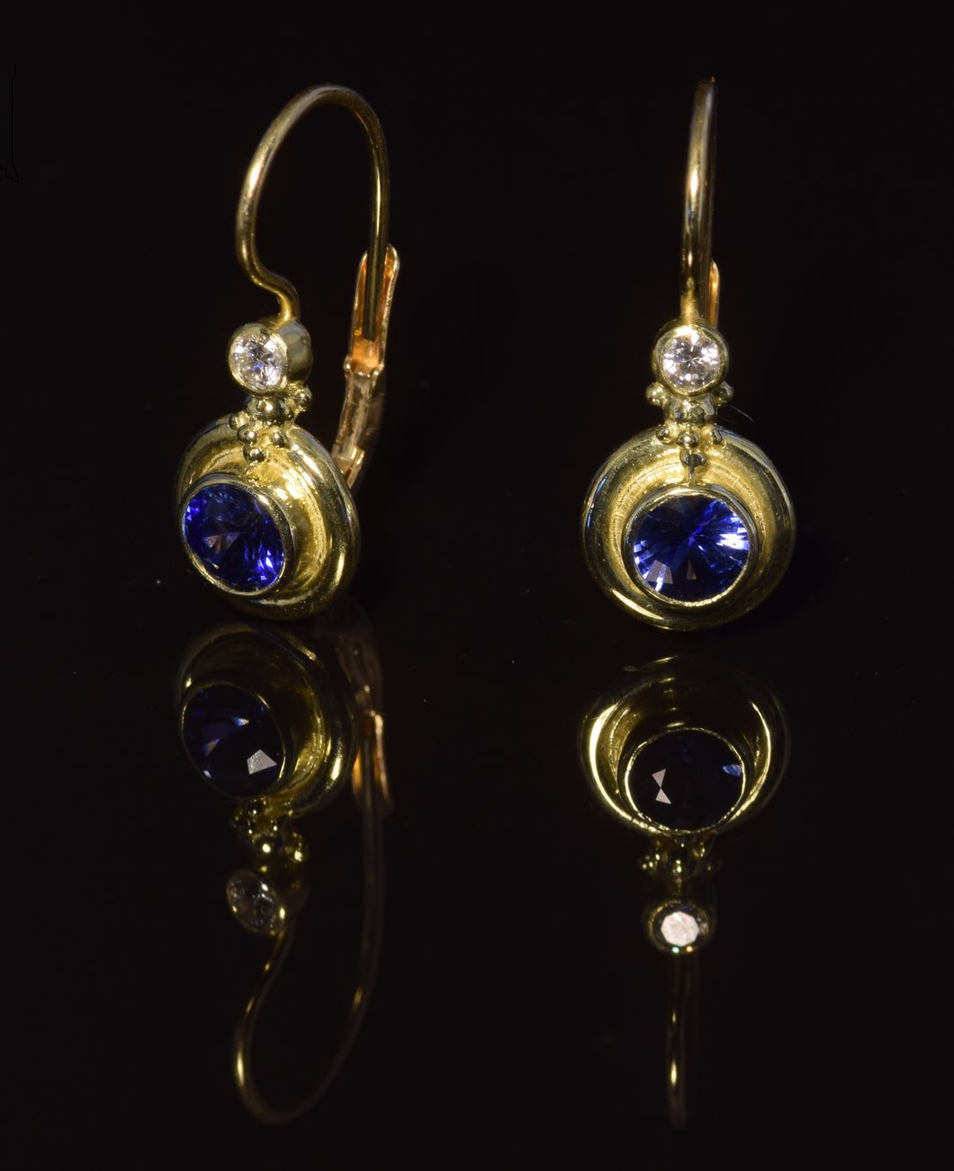 18K yellow gold 4 1/2 mm  faceted sapphire French hook earrings with 0,10 ct total weight diamond accent